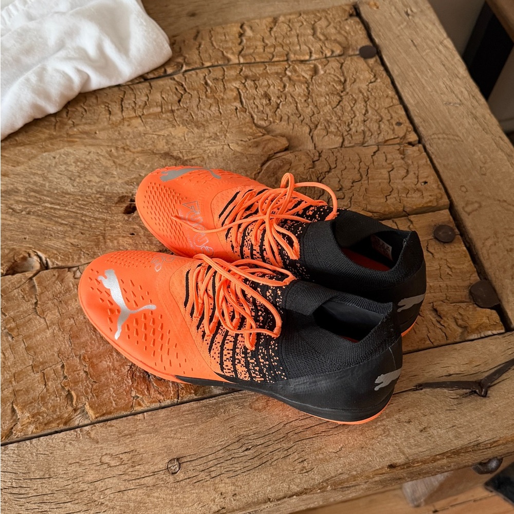 Puma Bright Orange and Black Soccer Cleats with Silver Logos